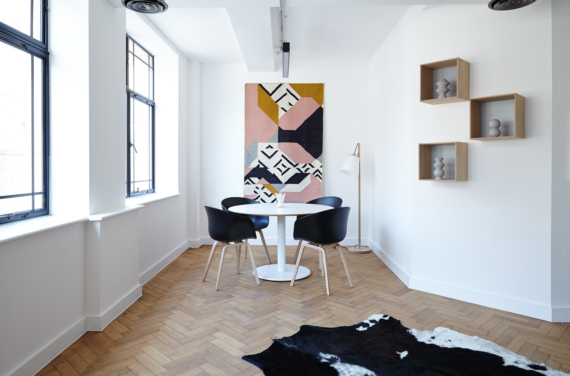 Modern dining nook with designer chairs and natural light